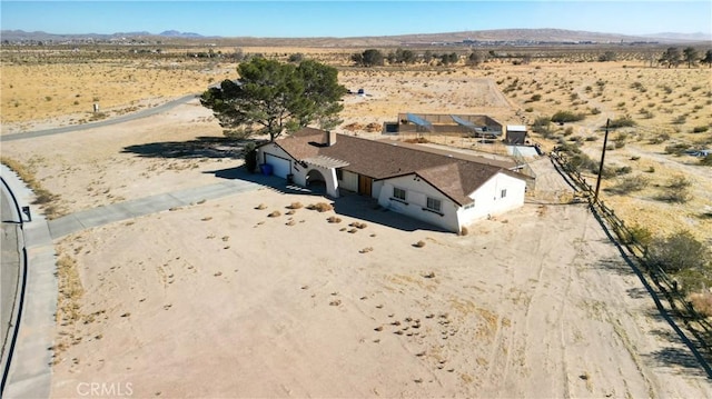 drone / aerial view featuring a mountain view