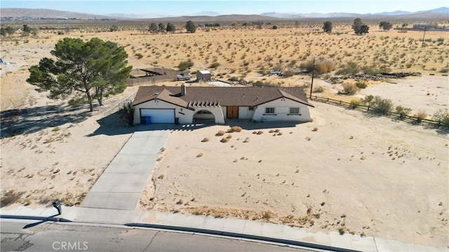 birds eye view of property with a mountain view