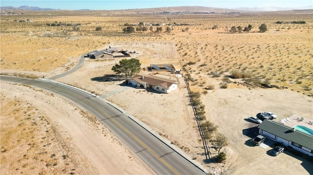 birds eye view of property featuring a mountain view