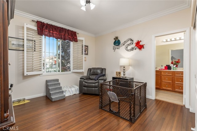 sitting room featuring crown molding and dark hardwood / wood-style floors