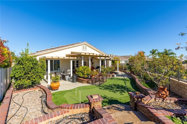 back of house with a patio