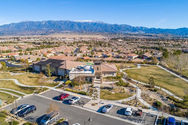 birds eye view of property featuring a mountain view