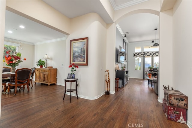 hall with ornamental molding and dark wood-type flooring