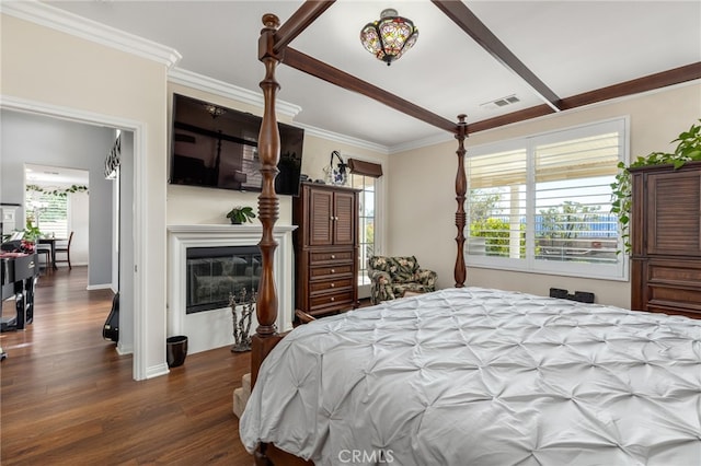 bedroom featuring dark hardwood / wood-style flooring and crown molding