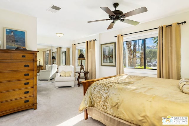 carpeted bedroom with ceiling fan