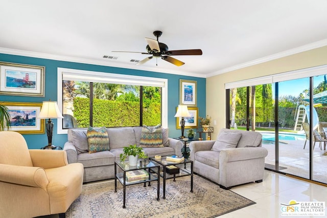 living room with ceiling fan, a healthy amount of sunlight, and ornamental molding