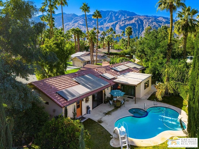 exterior space featuring a mountain view