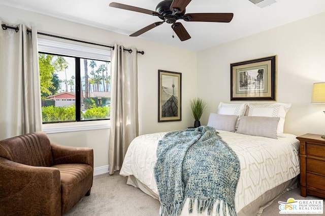 bedroom with ceiling fan and light colored carpet