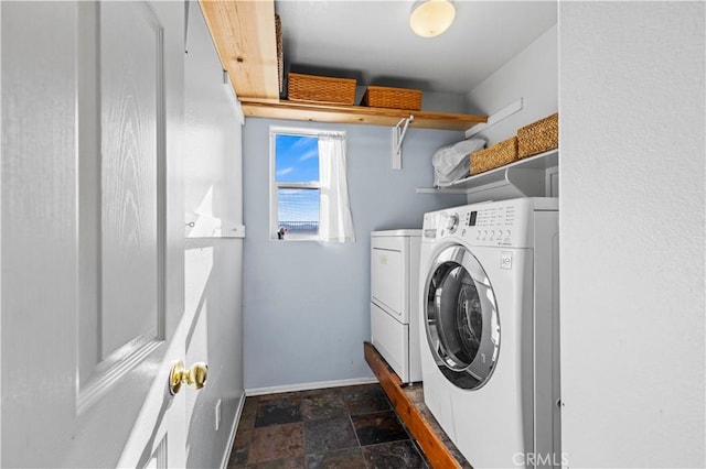 clothes washing area with independent washer and dryer