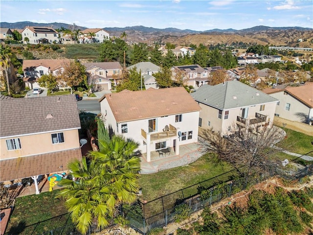 birds eye view of property featuring a mountain view