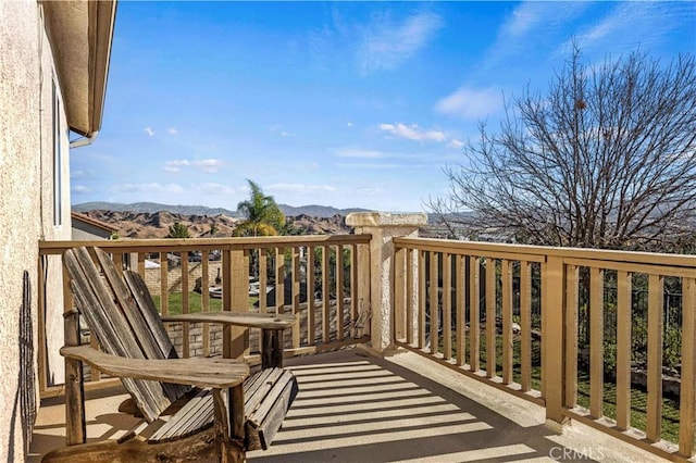 balcony featuring a mountain view