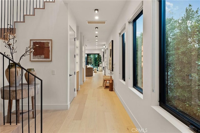 hall with light hardwood / wood-style flooring