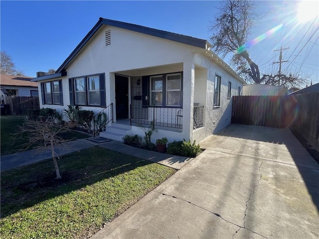 view of front of home with a porch and a front yard