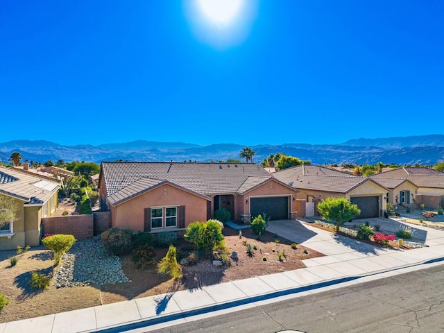 ranch-style house featuring a mountain view and a garage