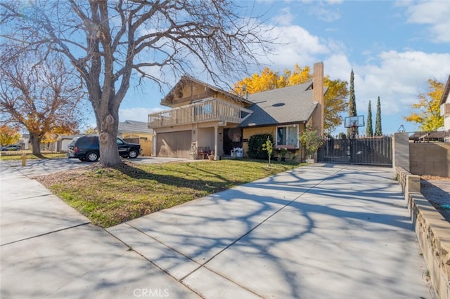 view of front of house featuring a balcony and a front yard