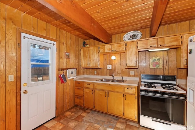 kitchen with wooden ceiling, sink, wooden walls, white gas range, and beam ceiling