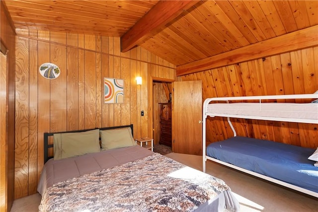 unfurnished bedroom with vaulted ceiling with beams, wood walls, carpet, and wooden ceiling