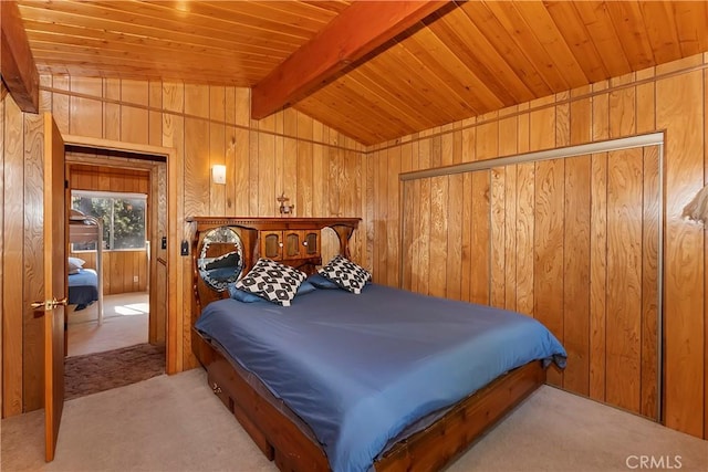 carpeted bedroom with lofted ceiling with beams, wooden ceiling, and wooden walls