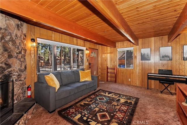 living room featuring beamed ceiling, a wealth of natural light, wooden walls, and wood ceiling