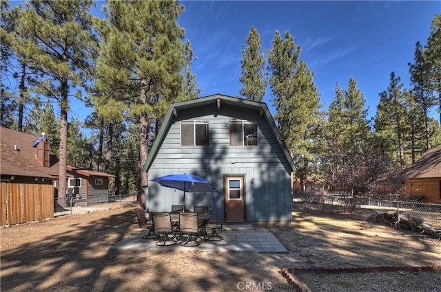 rear view of property featuring a patio area