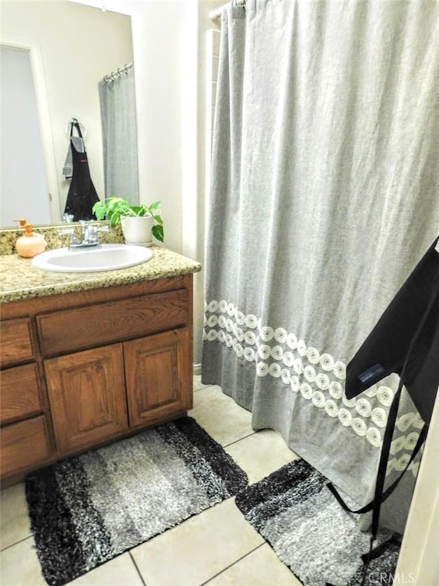 bathroom with vanity and tile patterned flooring