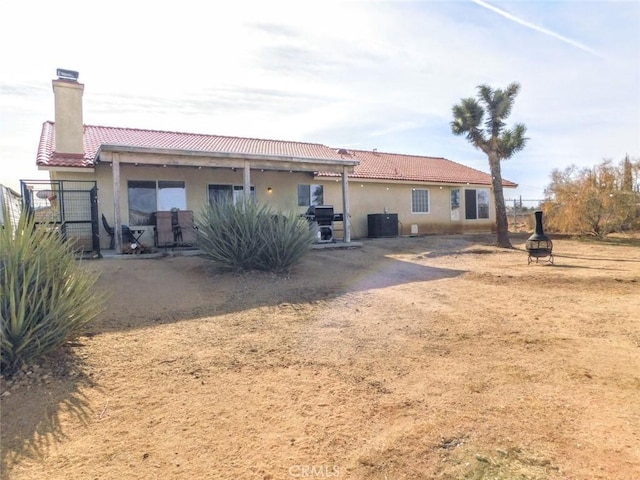 back of property with cooling unit