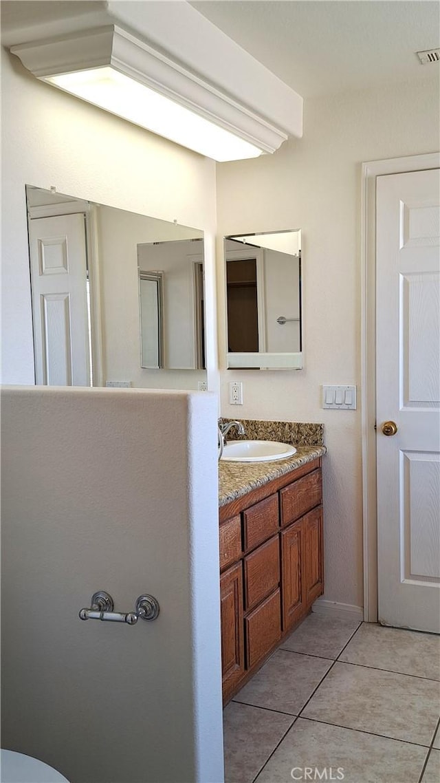 bathroom featuring vanity and tile patterned floors