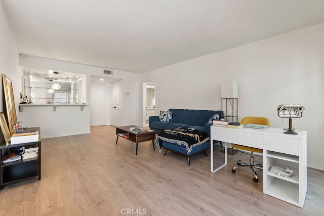 interior space featuring light wood finished floors and visible vents