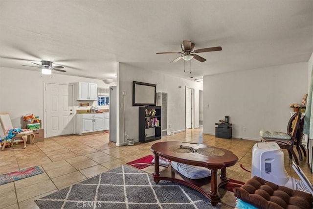 living room with ceiling fan and light tile patterned floors