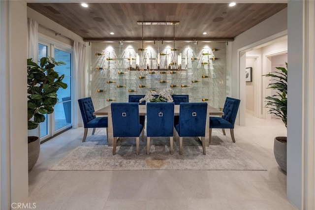 dining room featuring recessed lighting, wood ceiling, and a chandelier