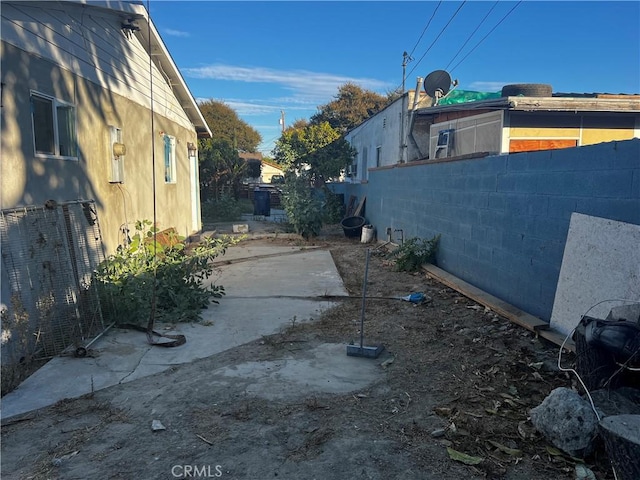 view of side of property with a patio