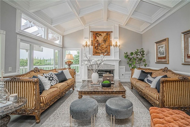 sunroom with coffered ceiling, lofted ceiling with beams, and a premium fireplace