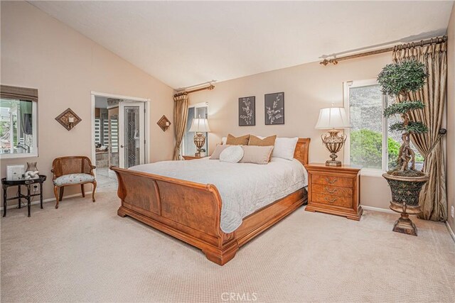 carpeted bedroom featuring vaulted ceiling