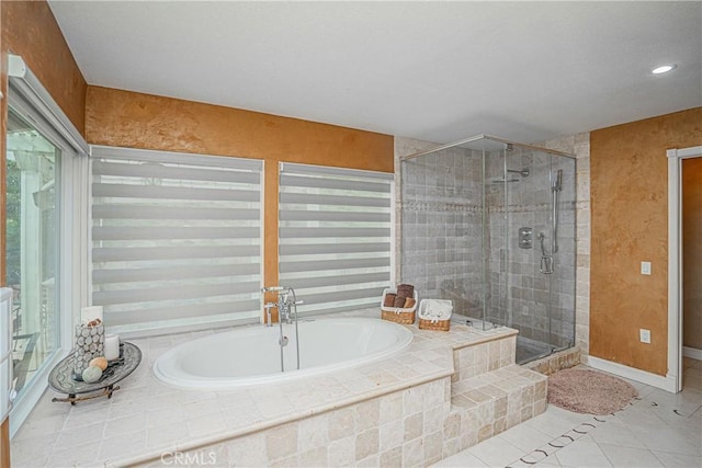 bathroom with tile patterned floors and plus walk in shower