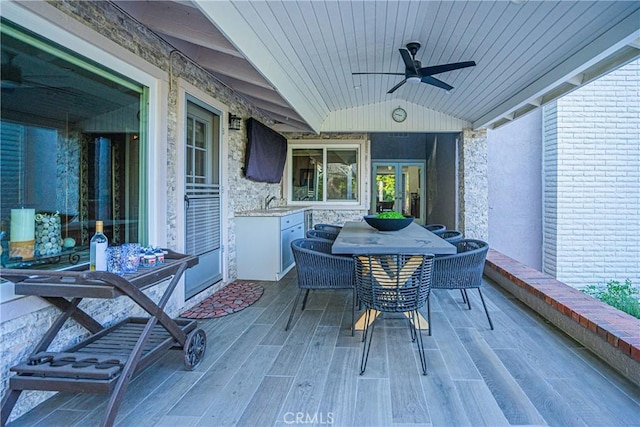 exterior space featuring a ceiling fan and outdoor dining area