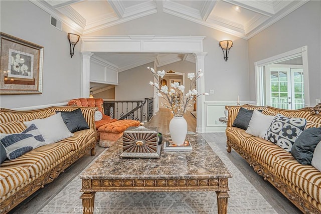 living area with crown molding, dark wood-style flooring, wainscoting, and decorative columns