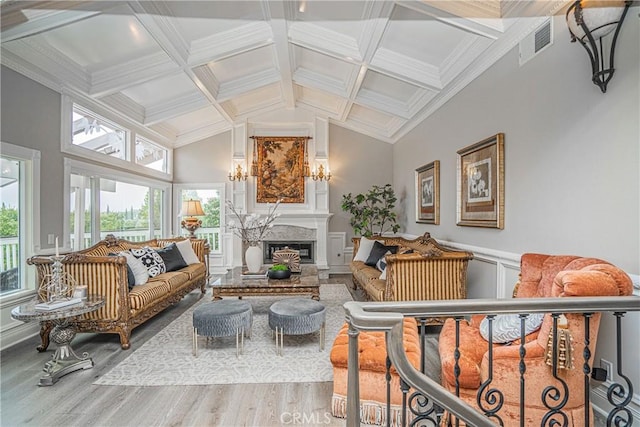 sunroom featuring lofted ceiling with beams, coffered ceiling, and an inviting chandelier