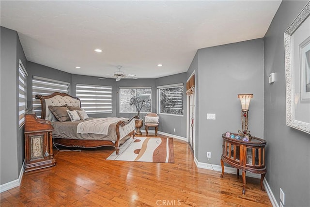 bedroom featuring wood-type flooring and ceiling fan