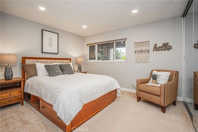 bedroom featuring light carpet, baseboards, and recessed lighting