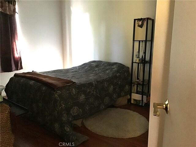 bedroom featuring wood-type flooring