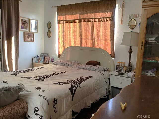 bedroom featuring multiple windows