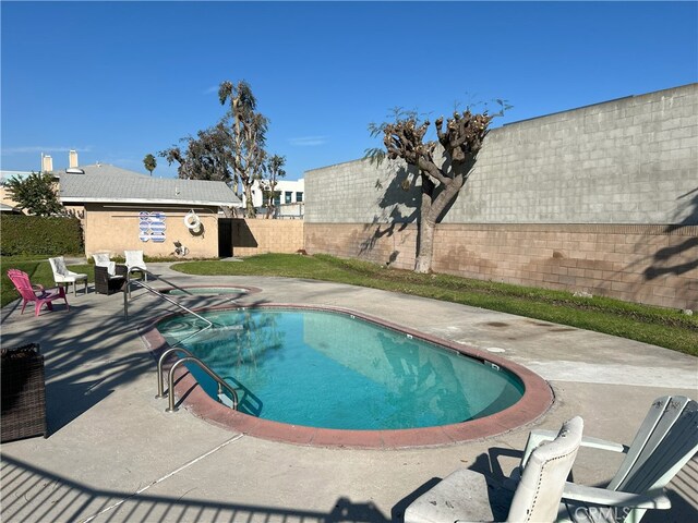 view of pool featuring a patio