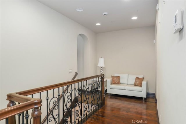 hallway with dark wood-type flooring