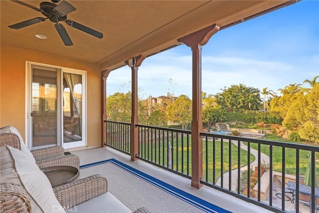 balcony with a ceiling fan and a sunroom