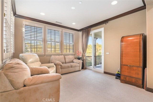 living room featuring light carpet and ornamental molding