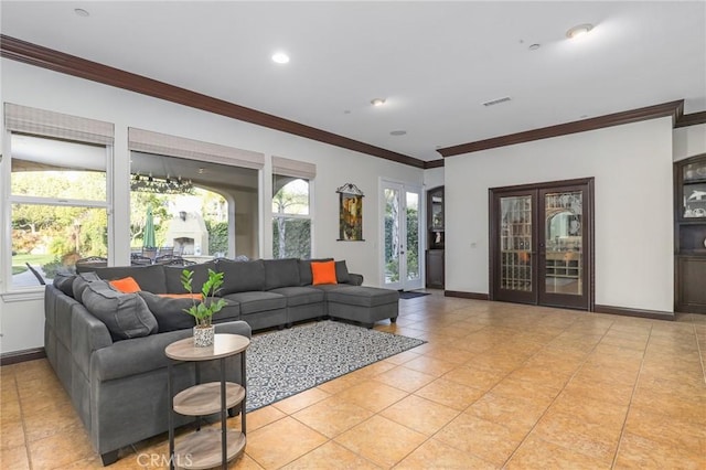 living room with baseboards, light tile patterned floors, visible vents, and crown molding