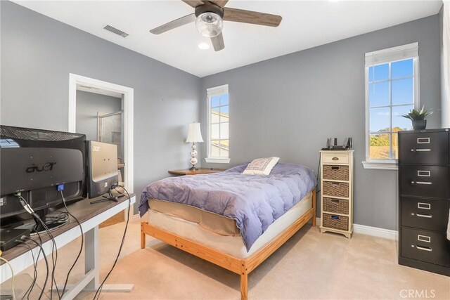 bedroom featuring ceiling fan and light colored carpet