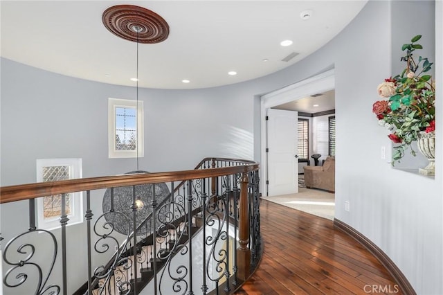 corridor featuring hardwood / wood-style flooring