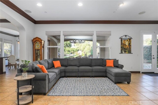 living room featuring crown molding, tile patterned floors, and french doors