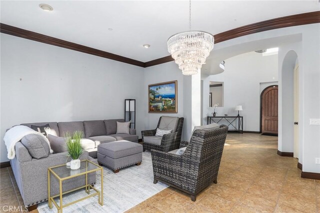 living room with crown molding and a notable chandelier